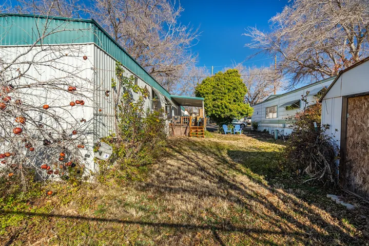 View of green lawn with a deck