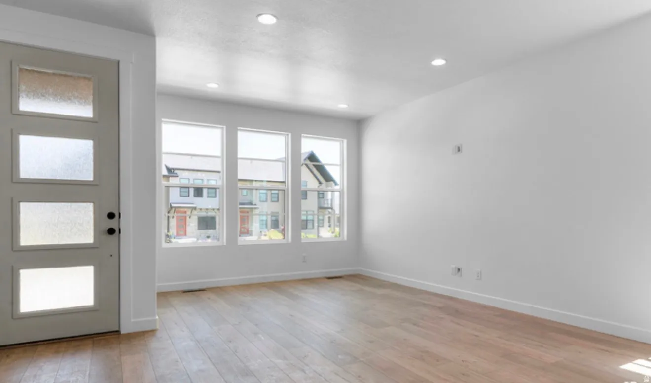 Entrance foyer featuring light wood finished floors and recessed lighting
