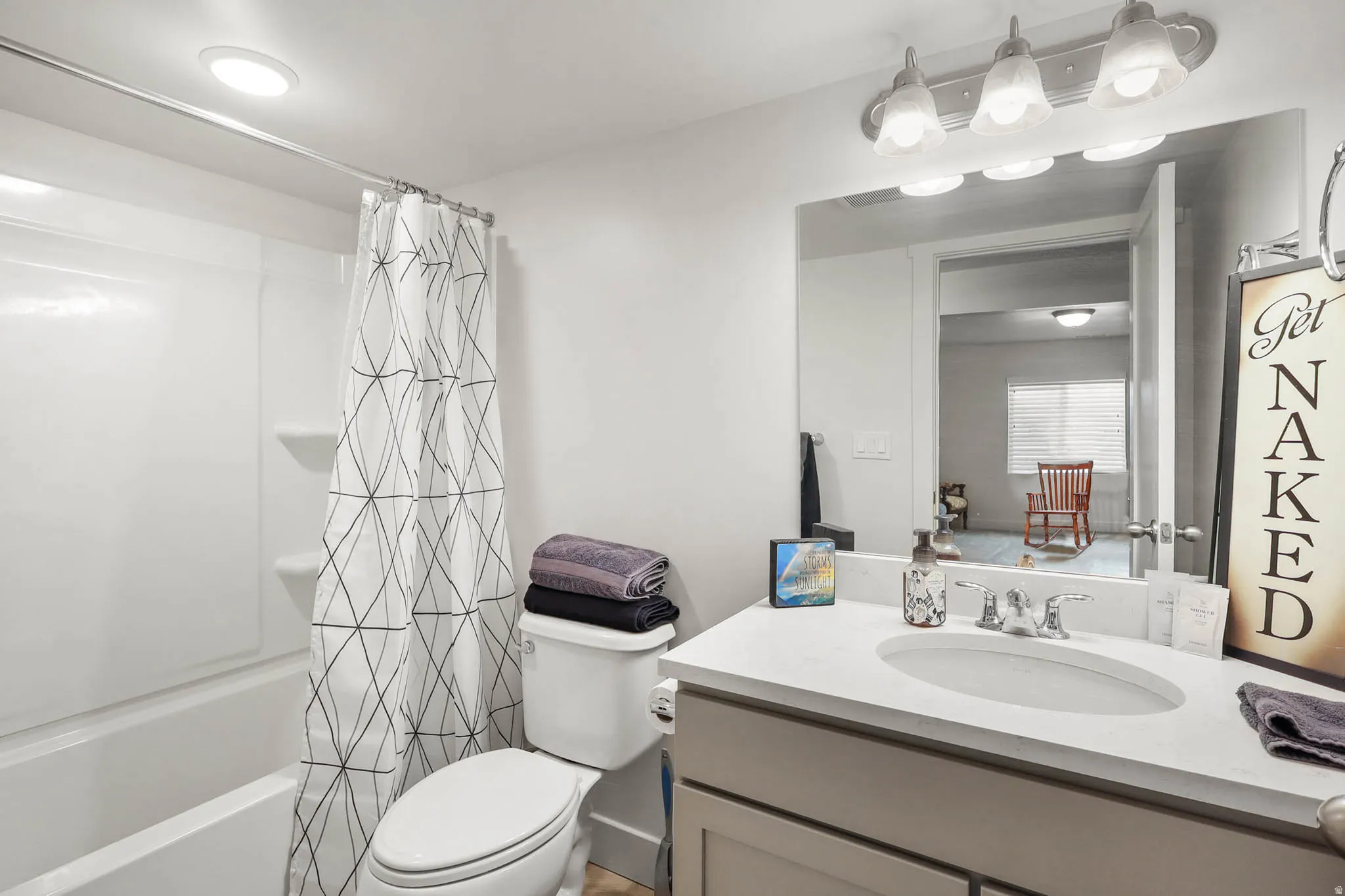 Full bathroom featuring vanity and shower / bath combo