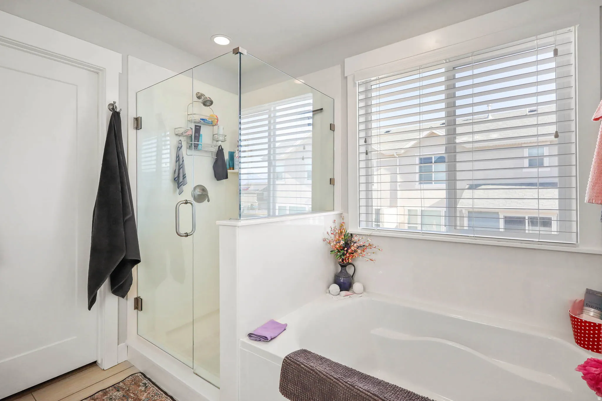 Full bath with a stall shower and a garden tub