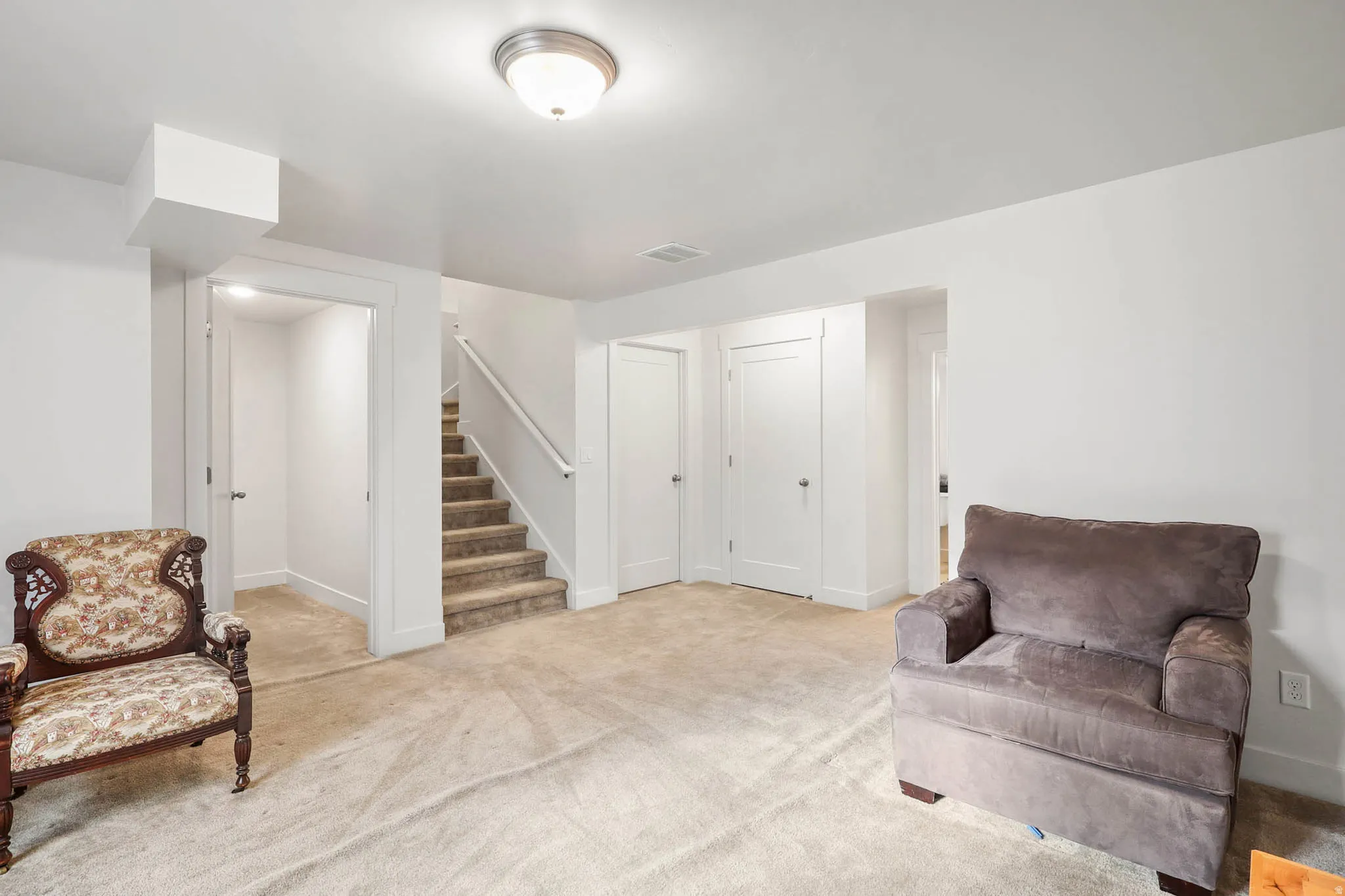 Living area with light carpet