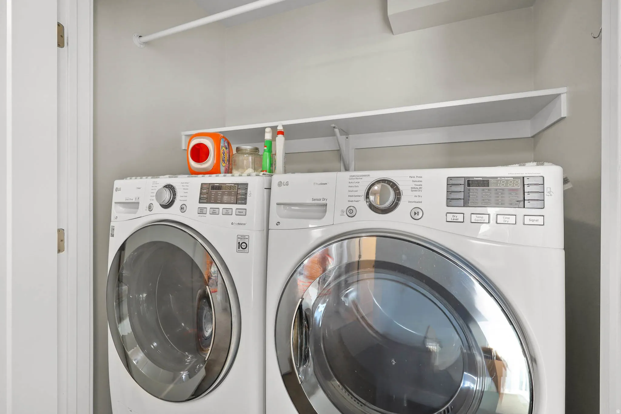 Laundry area featuring washing machine and clothes dryer