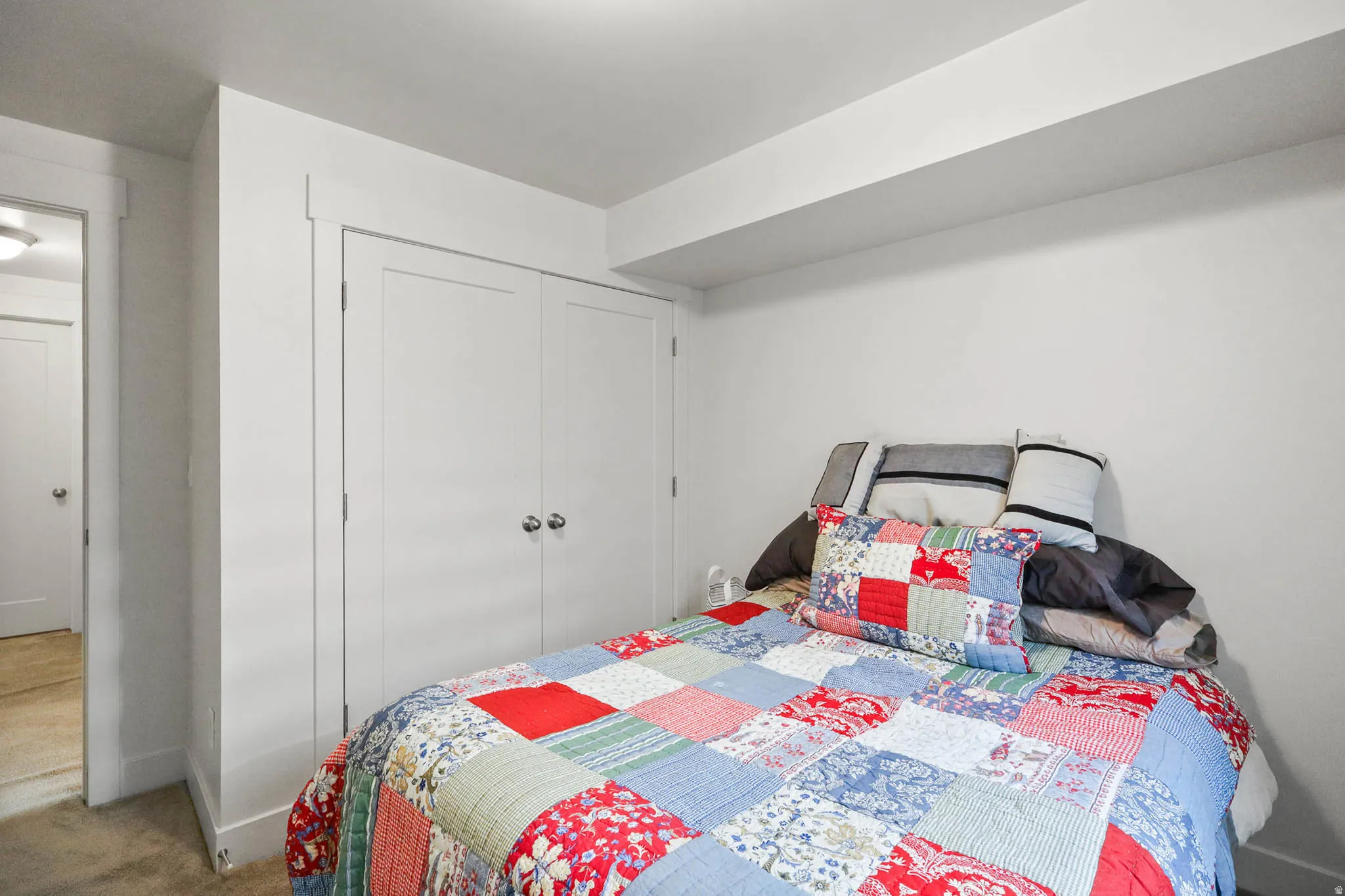 Bedroom featuring carpet floors and a closet