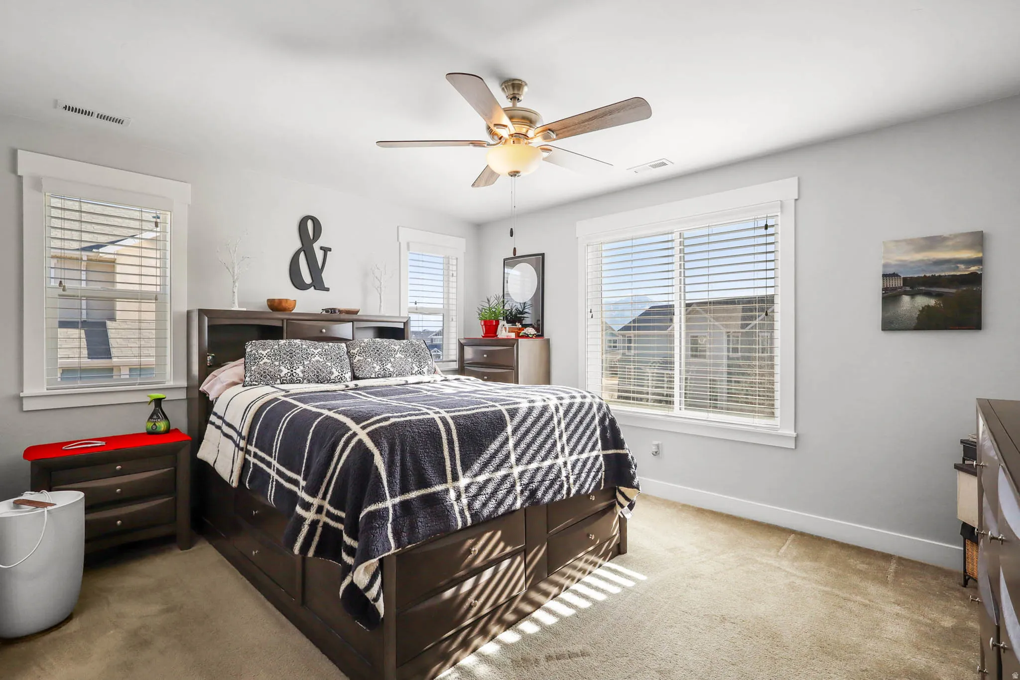 Bedroom with light carpet and ceiling fan