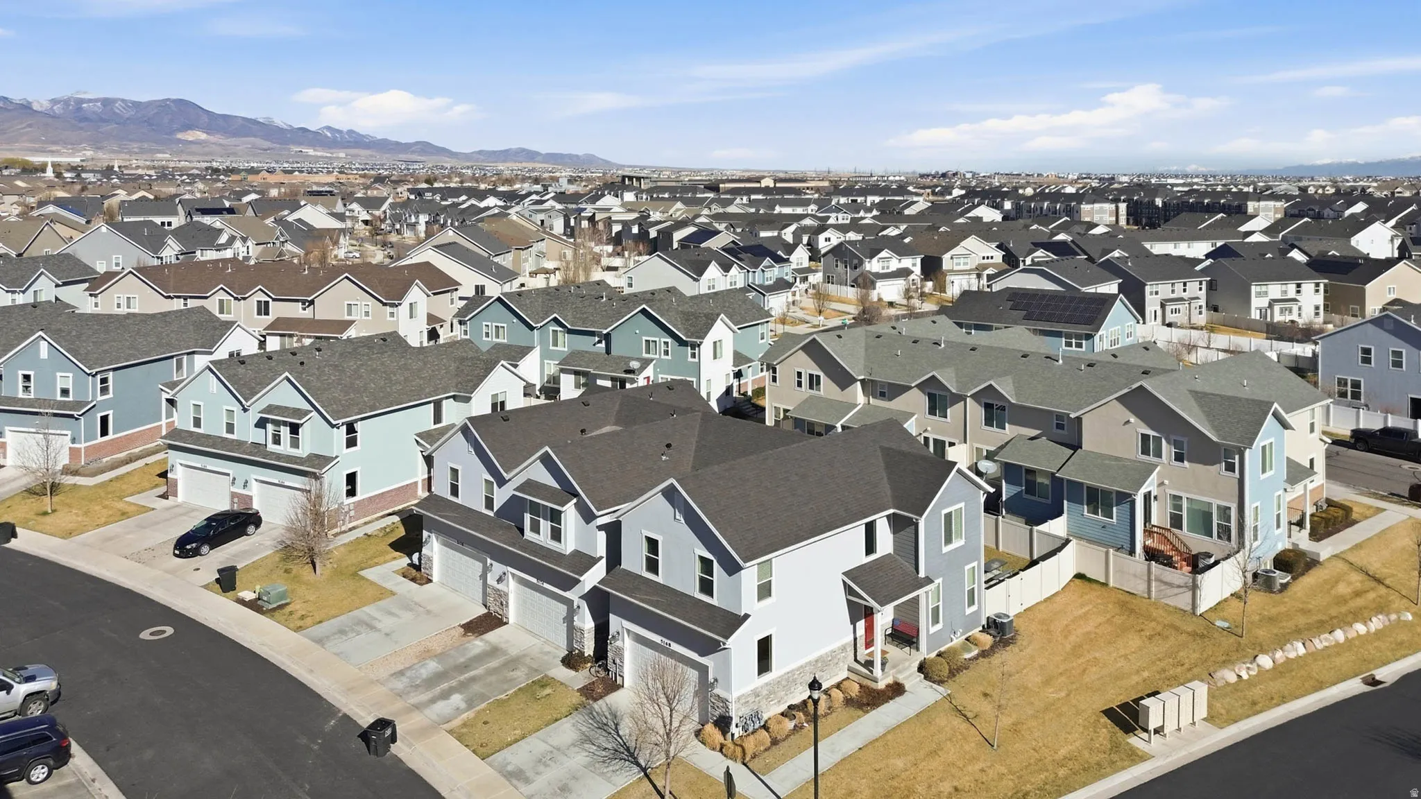 Aerial view of residential area with mountains