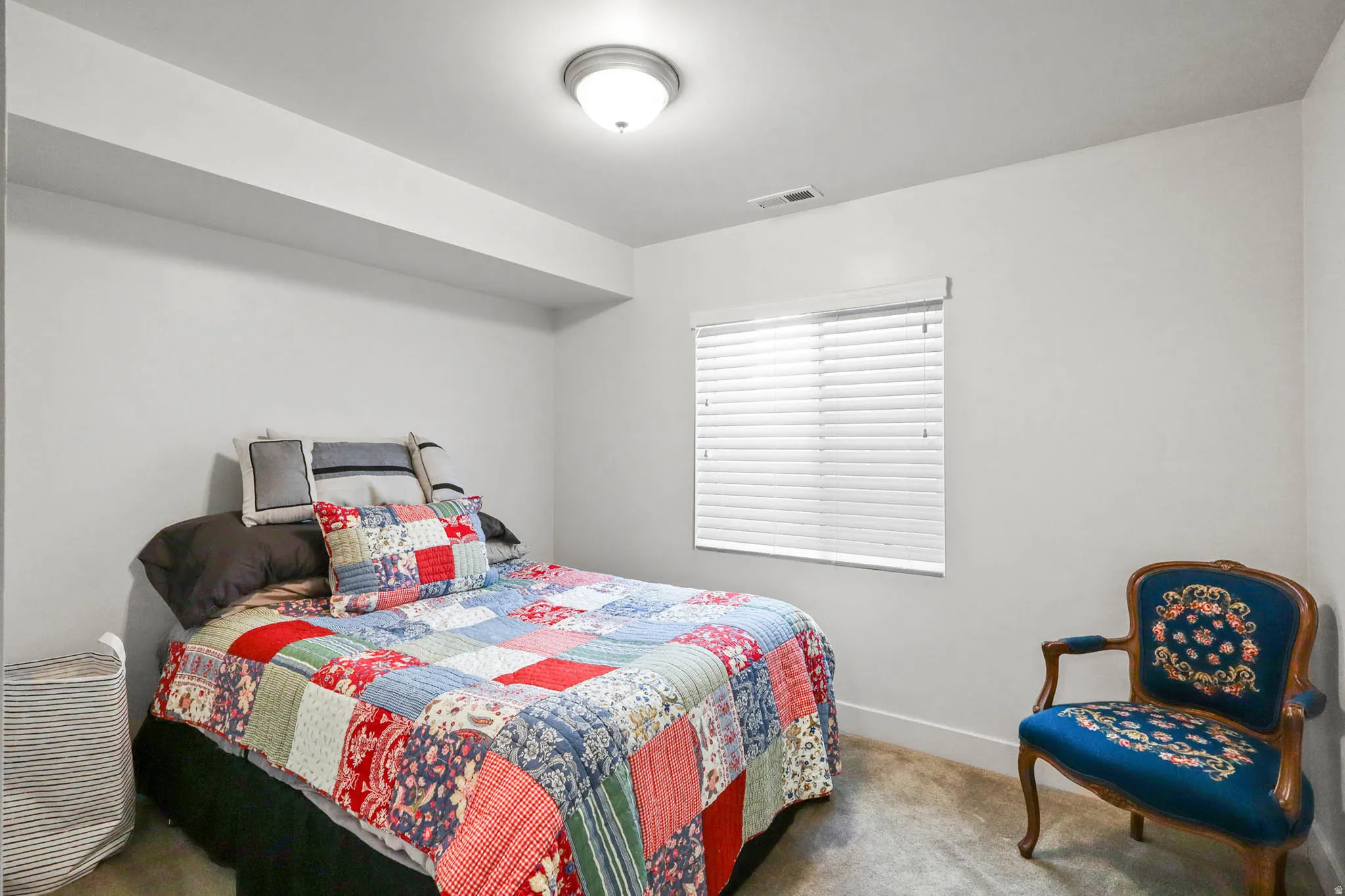 Carpeted bedroom with baseboards