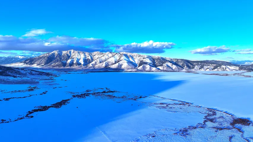 View of mountain backdrop with a nearby body of water