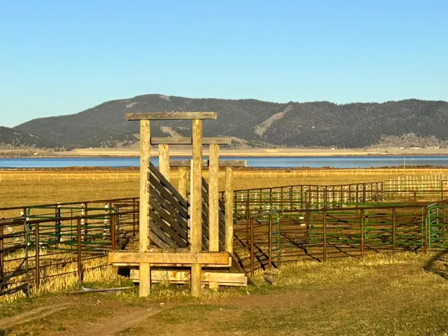 Horse barn featuring a water and mountain view