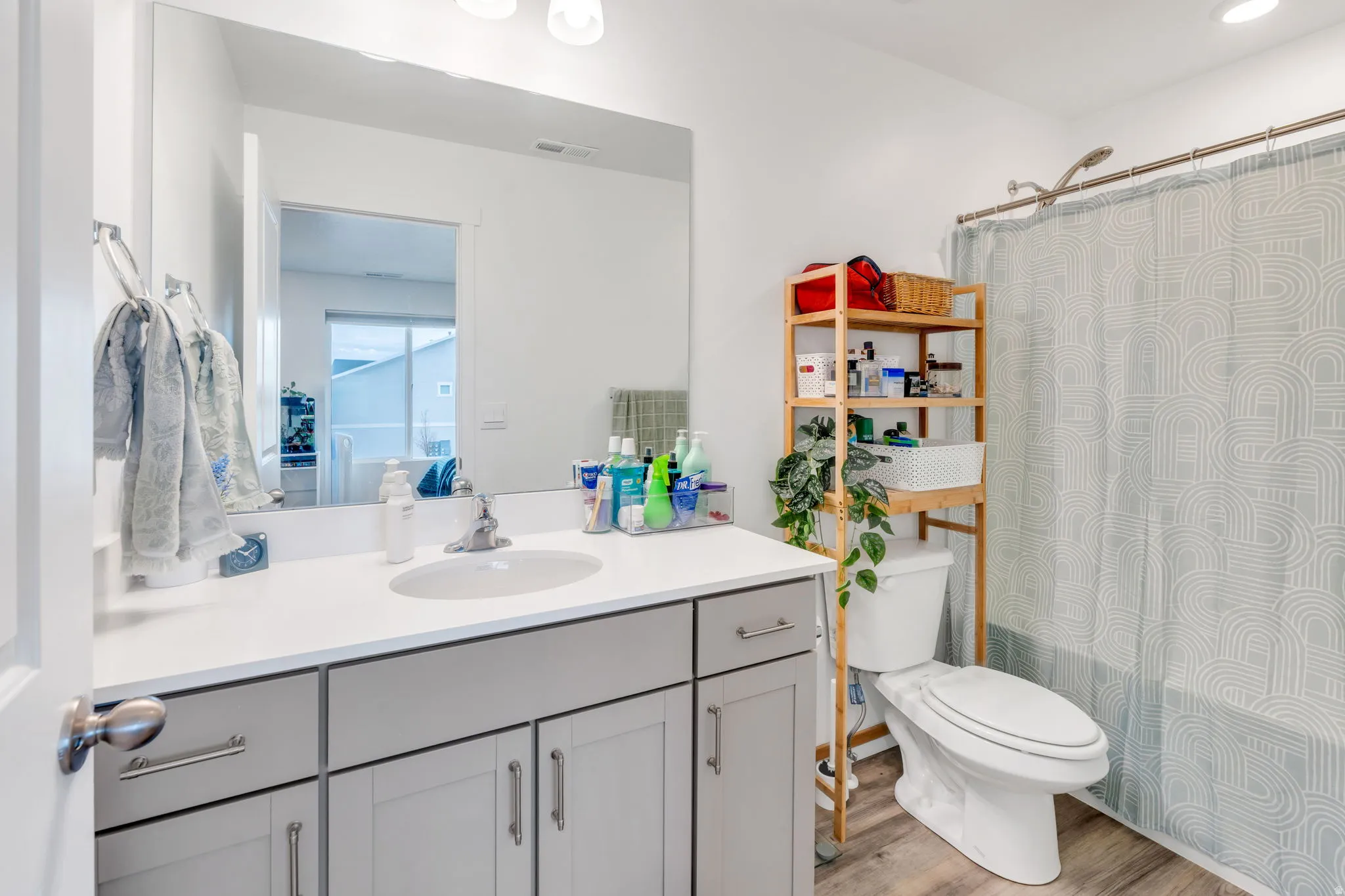 Bathroom featuring vanity and light wood-style flooring
