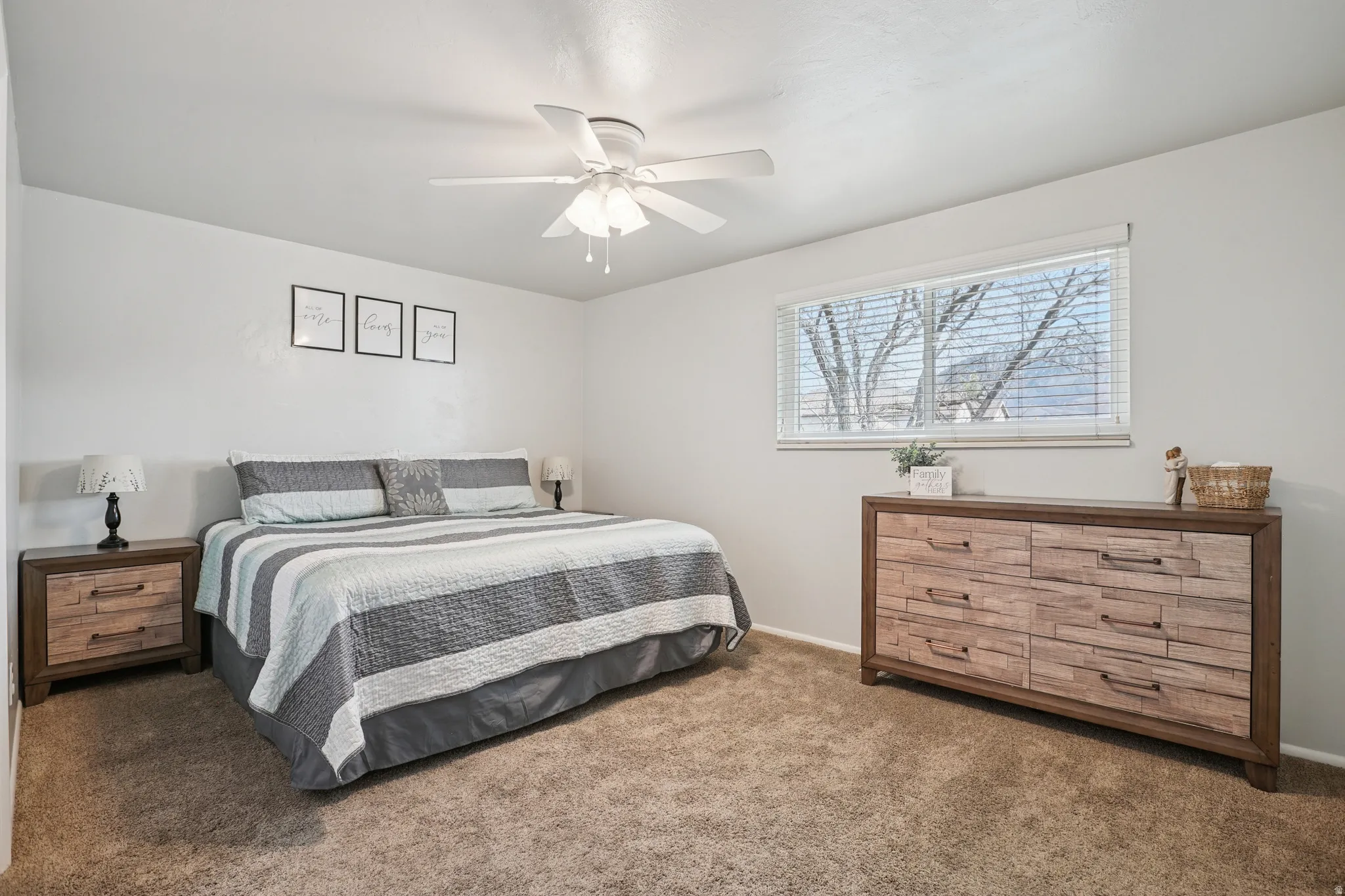 Bedroom featuring dark carpet and a ceiling fan