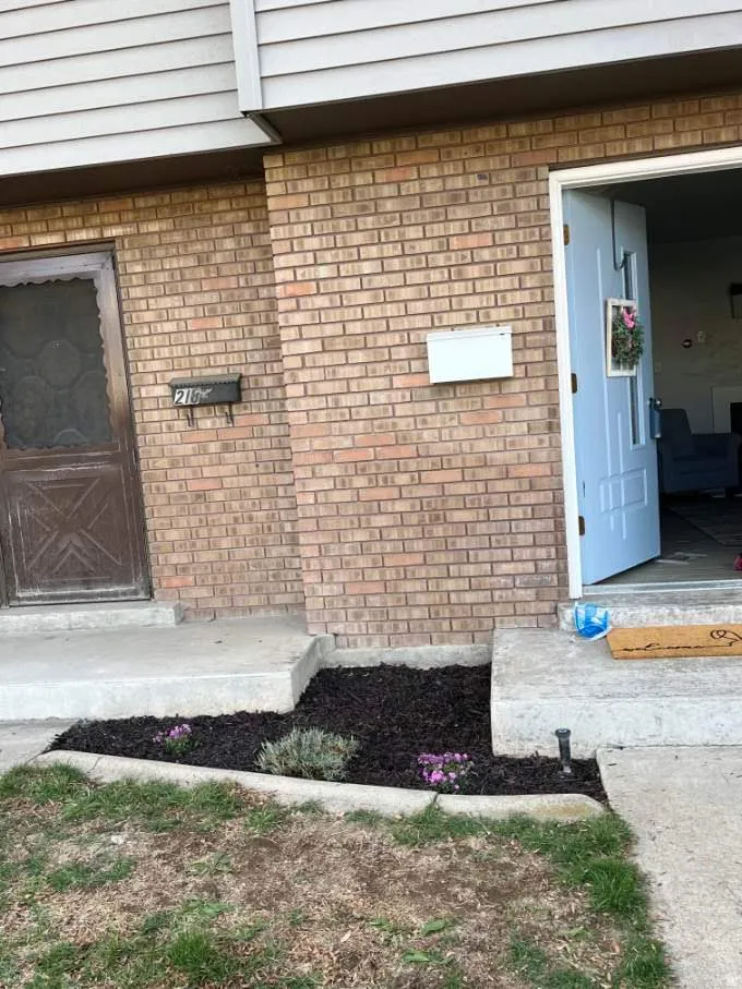 Property entrance with brick siding
