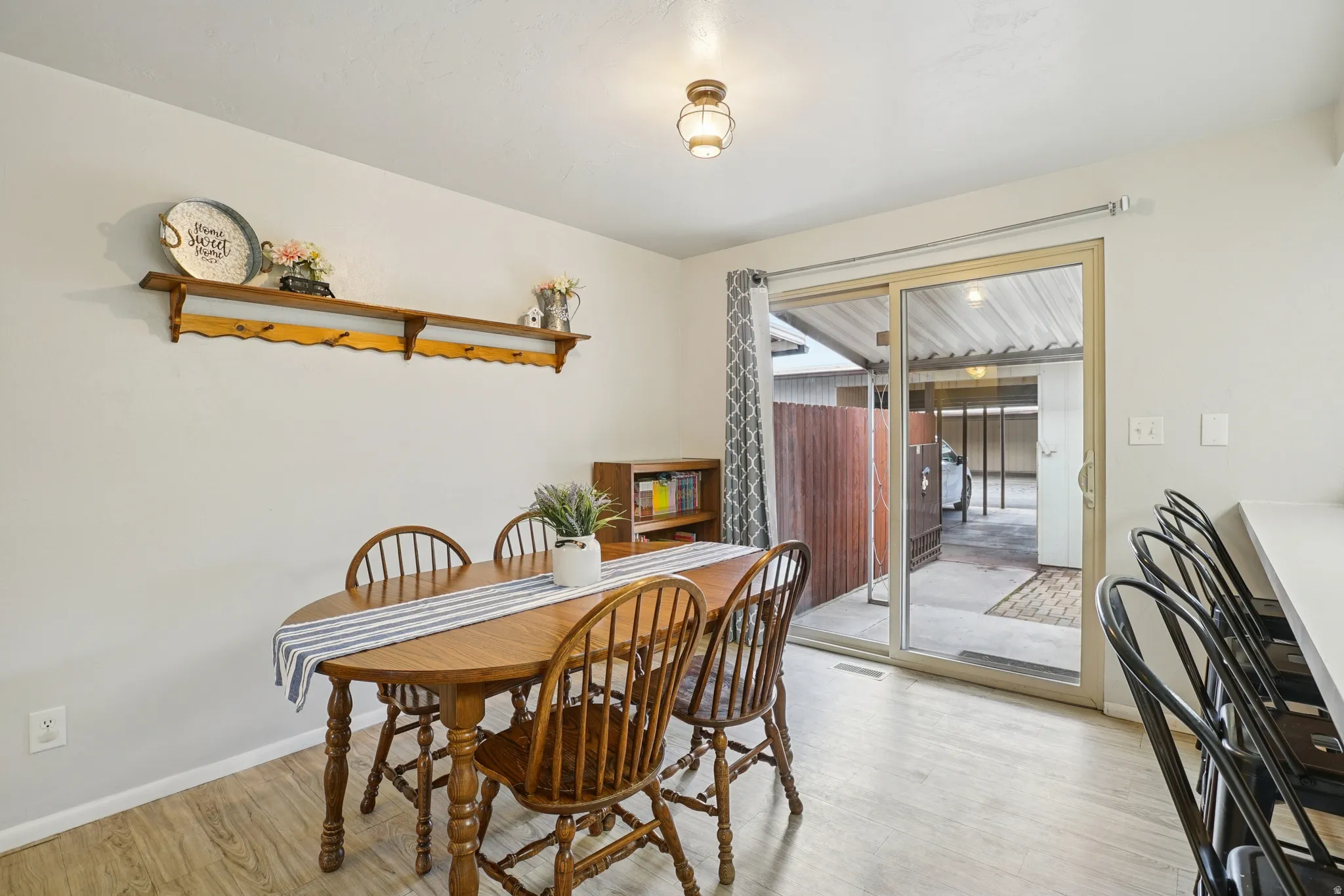Dining space featuring baseboards and light wood-style floors