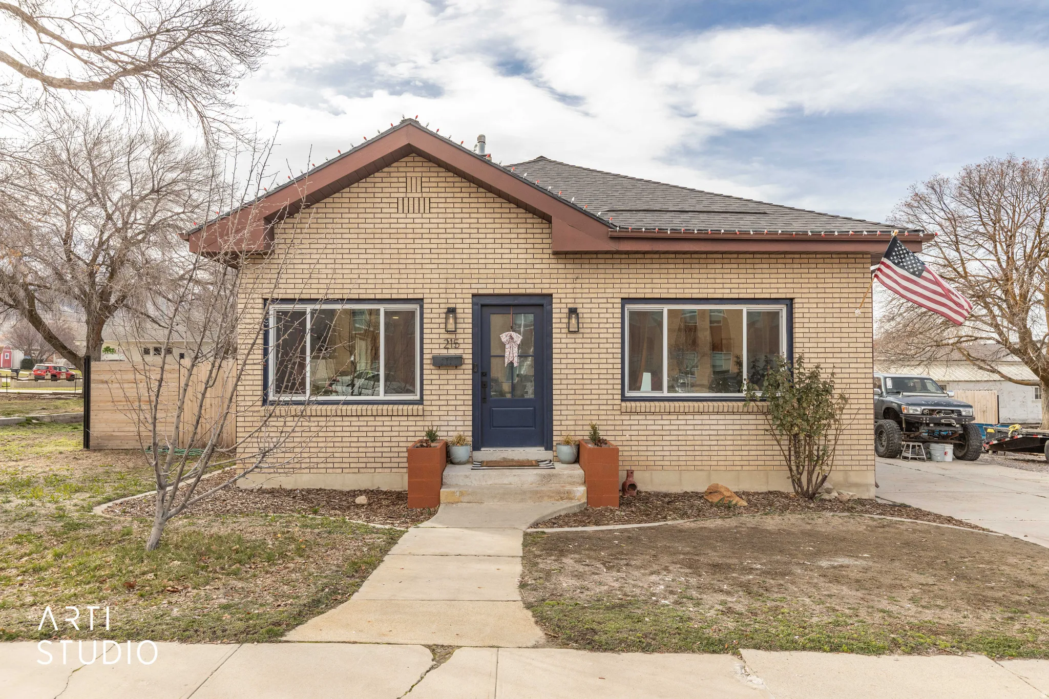 Bungalow-style house featuring brick siding