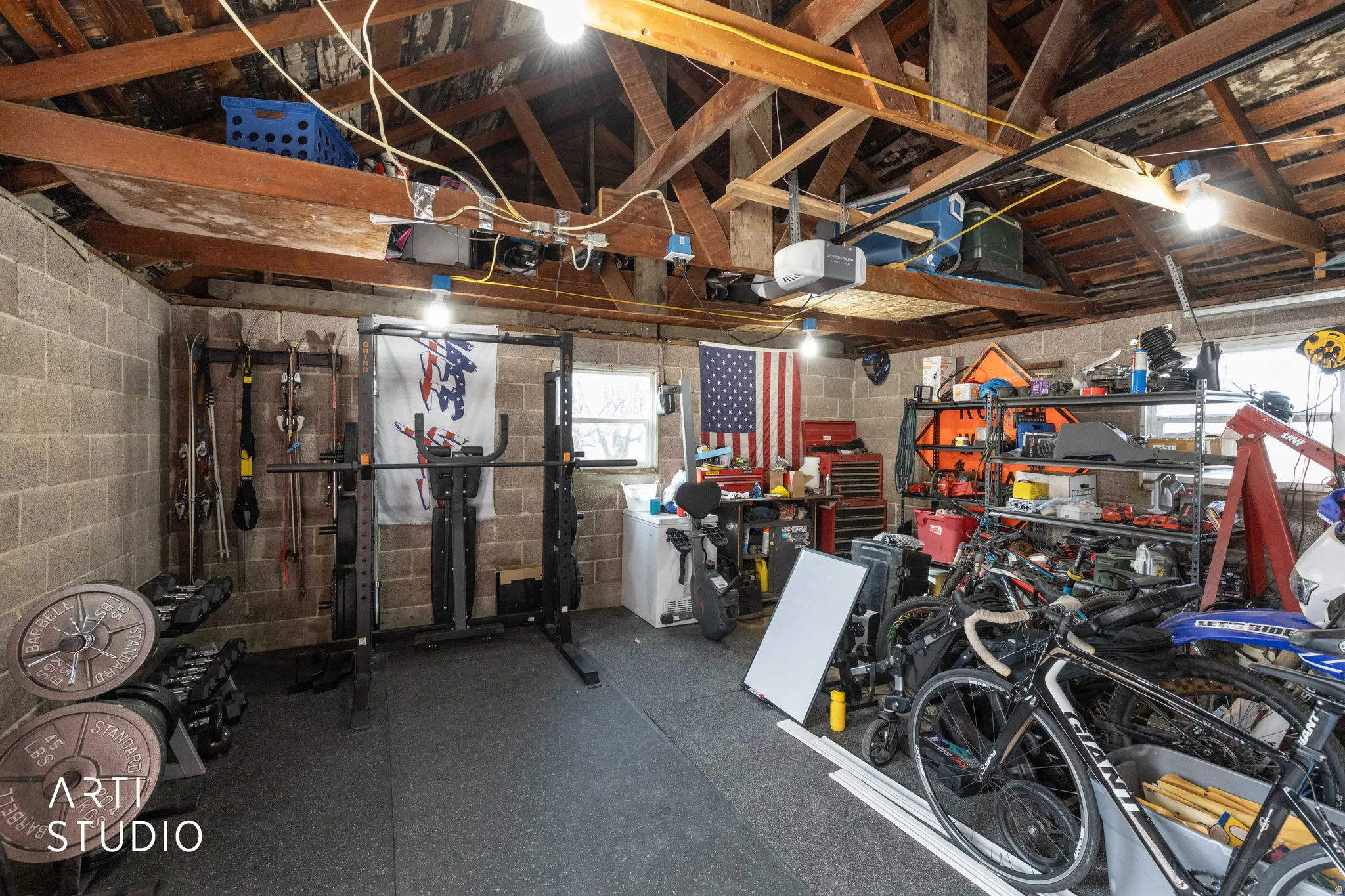 Garage with a garage door opener and concrete block wall