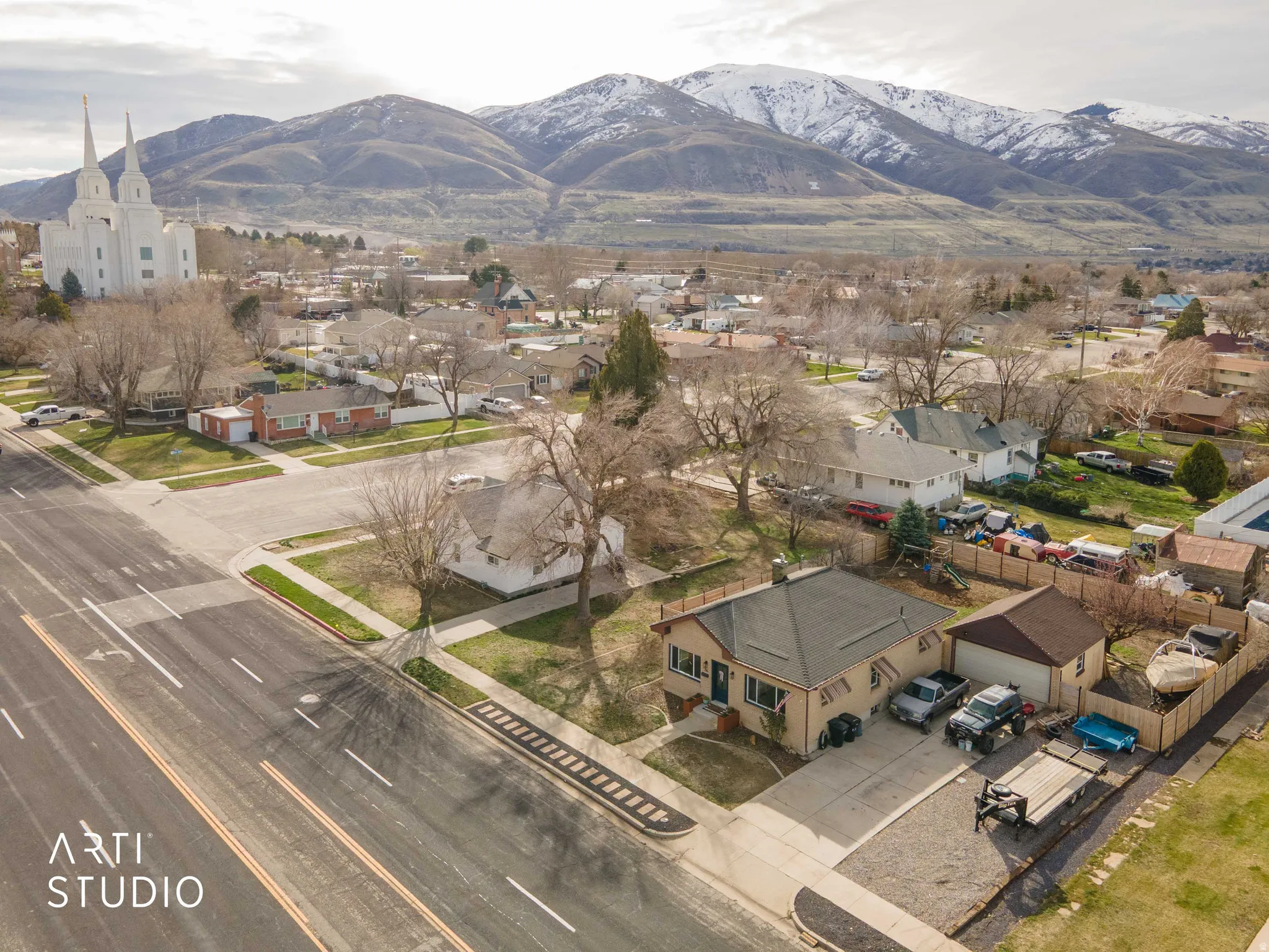 Aerial view of residential area featuring mountains