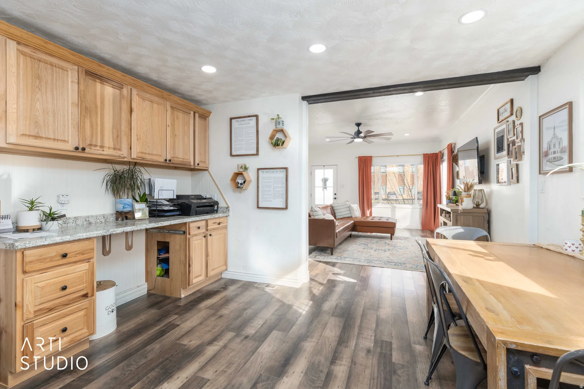 Kitchen with open floor plan, dark wood-style floors, a ceiling fan, recessed lighting, and light stone countertops