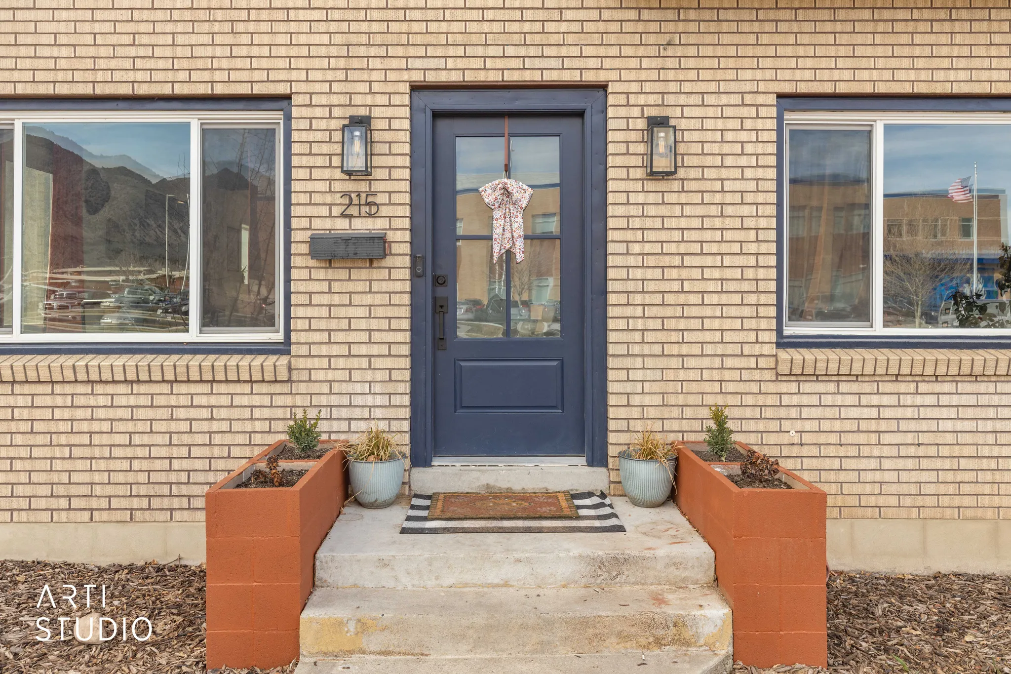 Doorway to property with brick siding