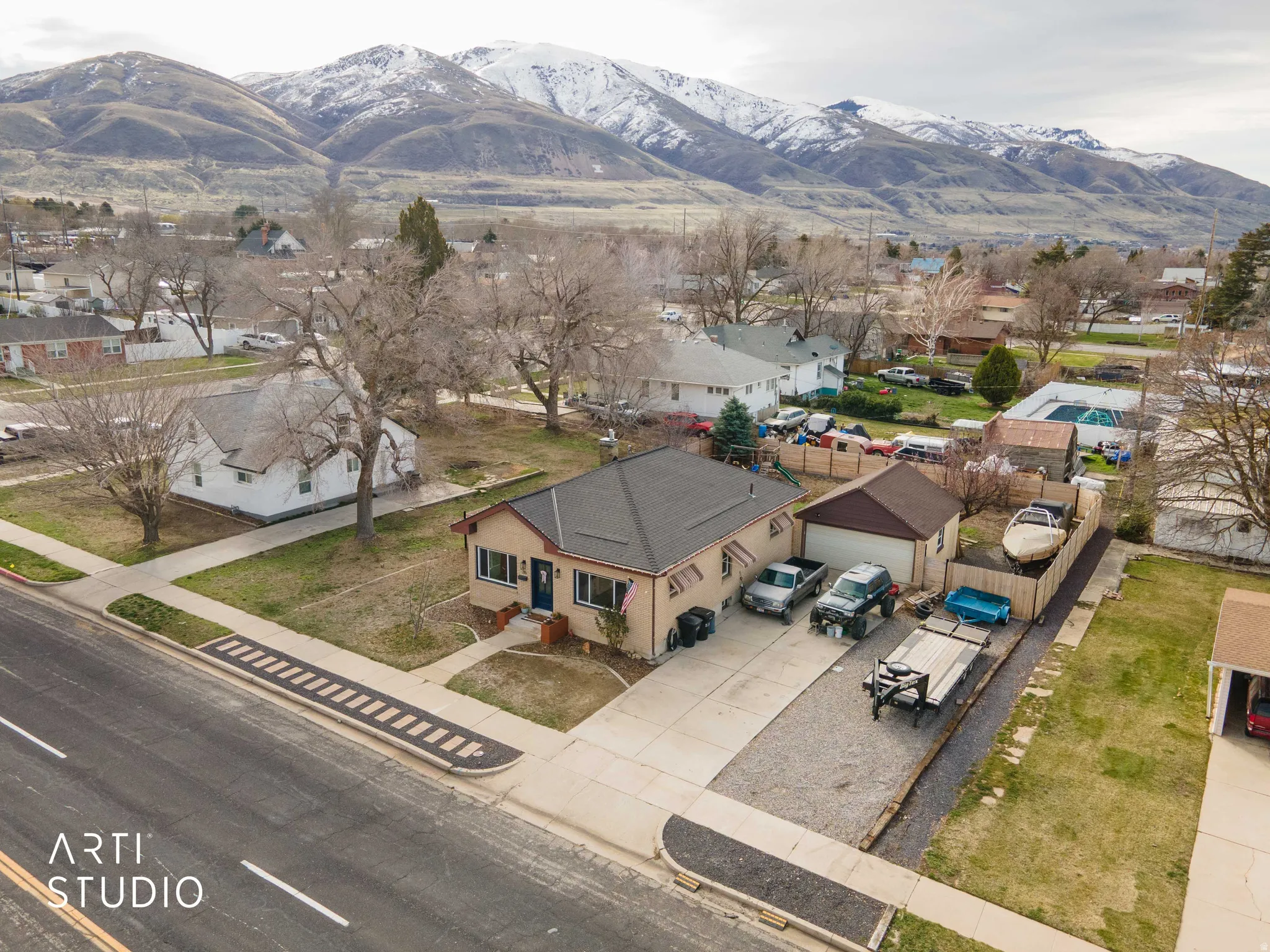 Aerial view of residential area featuring a mountainous background