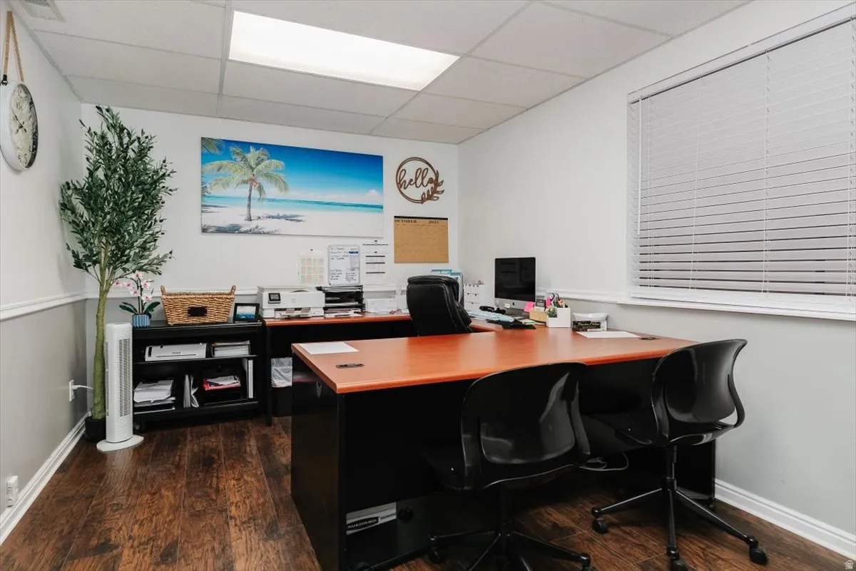 Office with a paneled ceiling