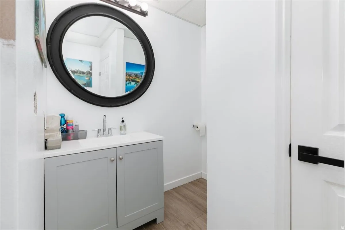 Bathroom featuring vanity and light wood-type flooring