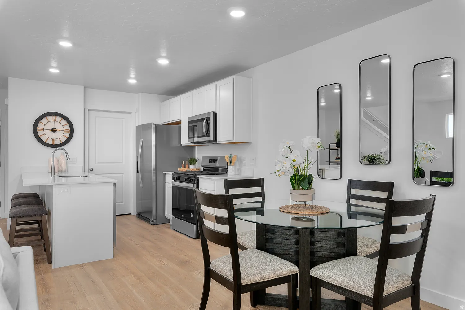 Dining space featuring light wood-type flooring and recessed lighting