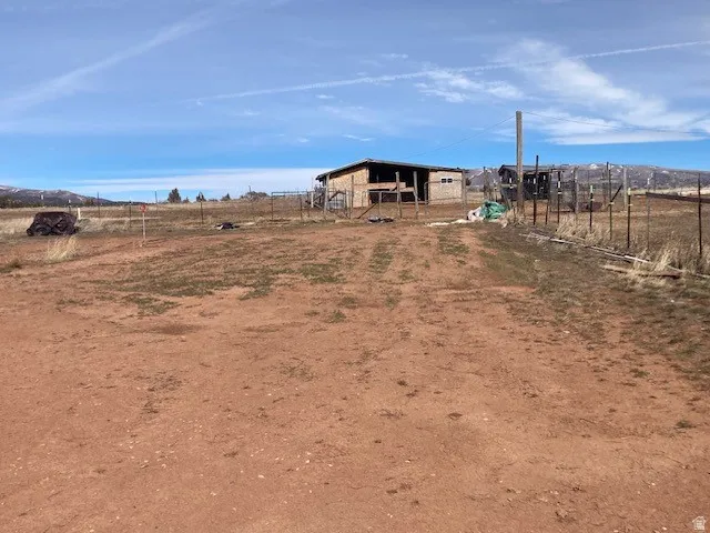 View of yard with a rural view
