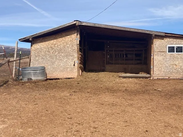 View of side of home featuring stucco siding