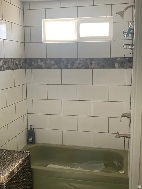 ADU Bathroom featuring bathtub / shower combination