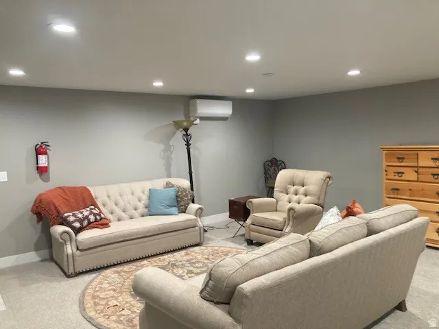 Basement Living room featuring carpet floors and recessed lighting
