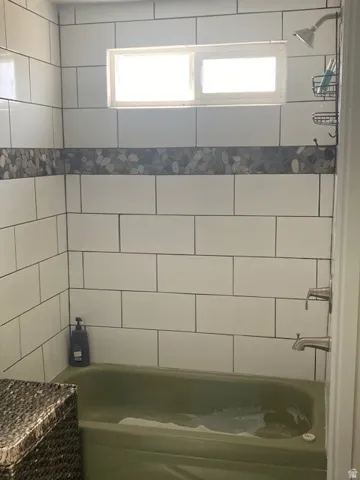 ADU Bathroom featuring bathtub / shower combination