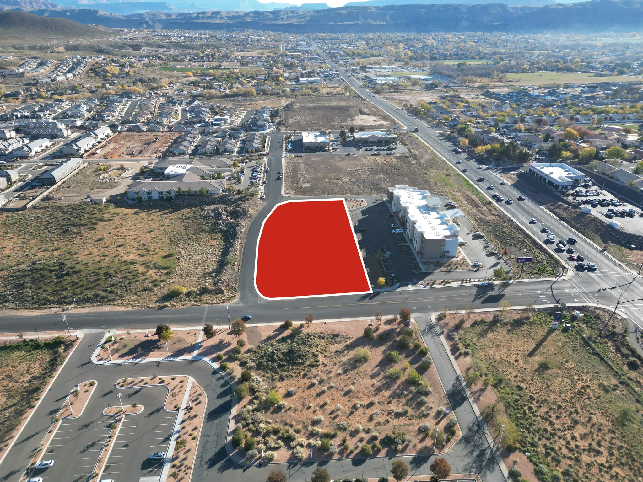 Aerial overview of property's location with a mountainous background