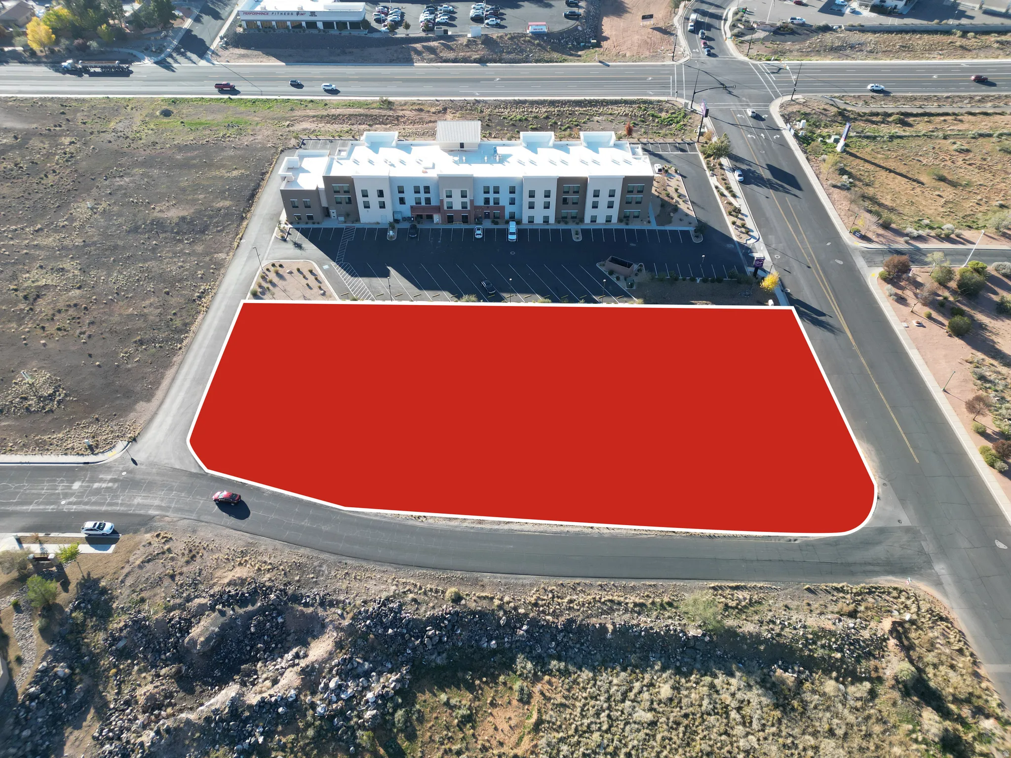 Aerial view of property's location featuring apartment complex