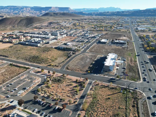 Aerial view of property and surrounding area featuring mountains