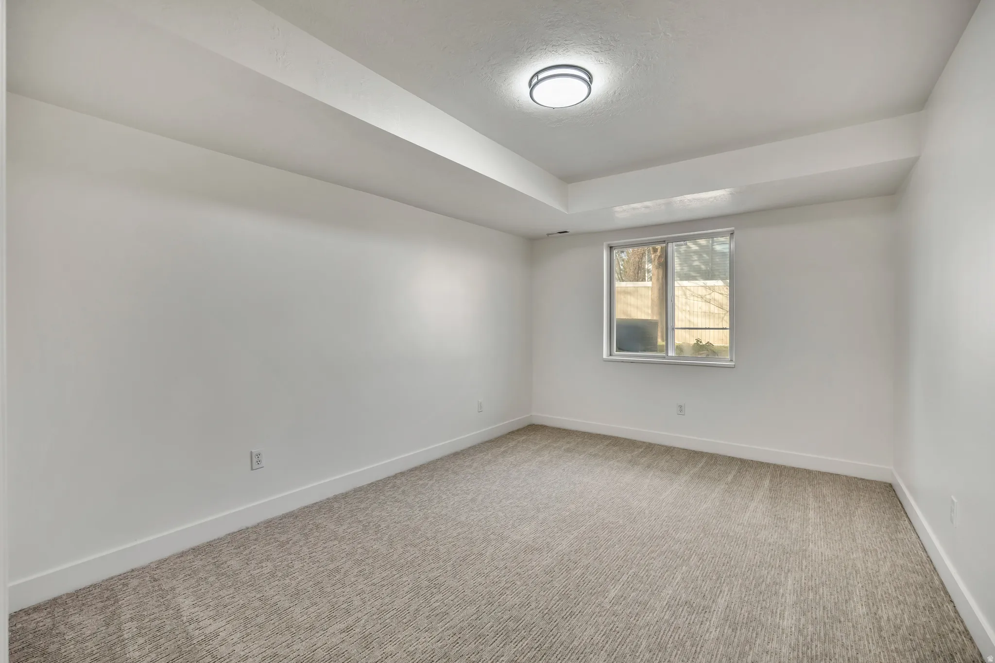 Unfurnished room featuring baseboards and carpet floors