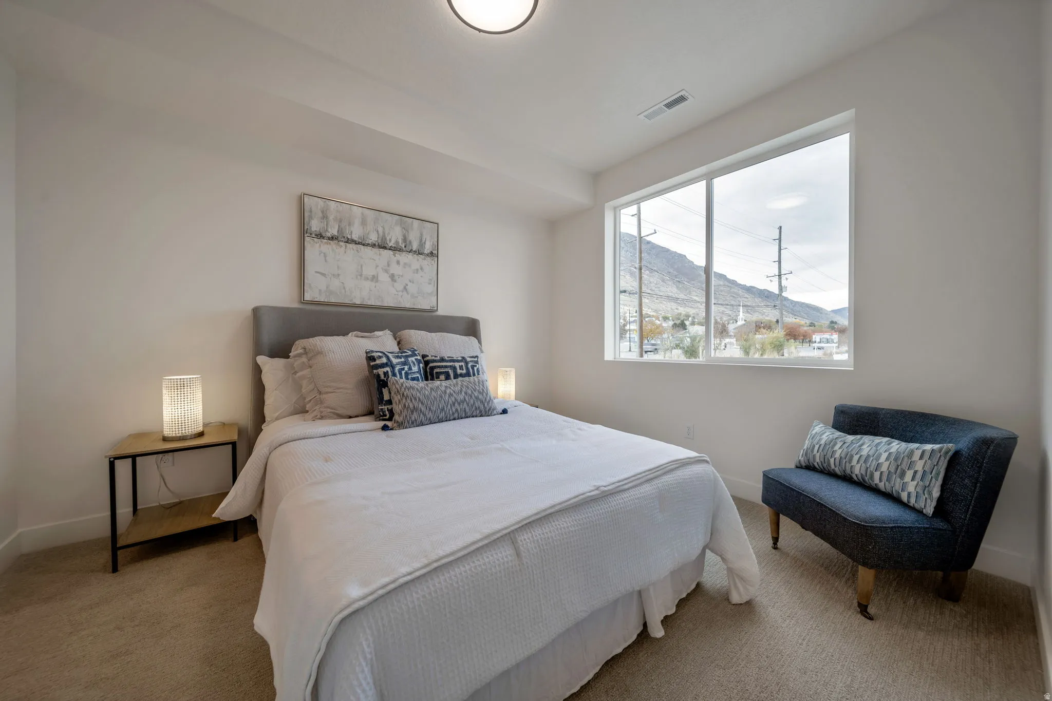 Bedroom with a mountain view and carpet floors