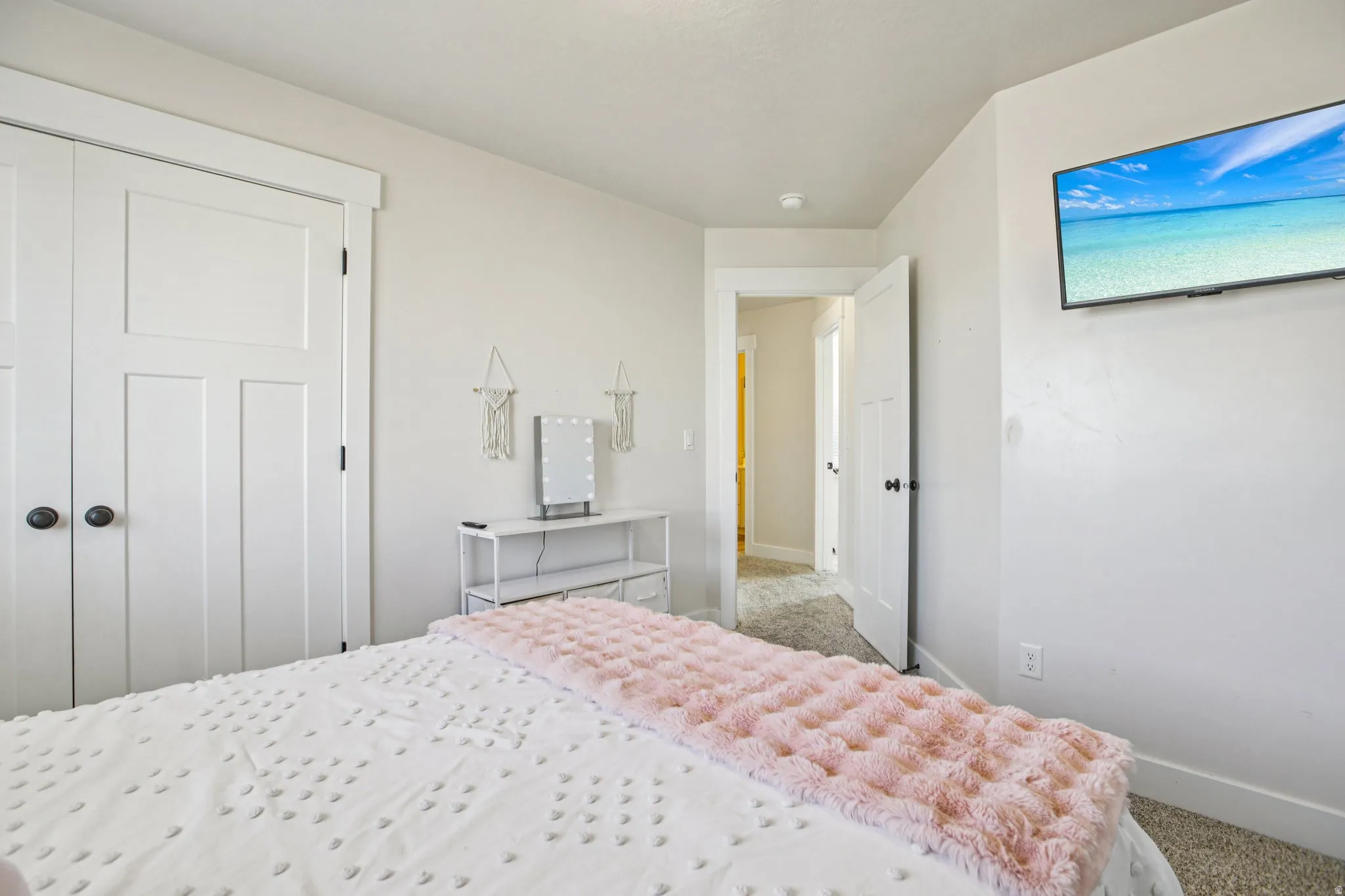 Bedroom featuring carpet floors and a closet