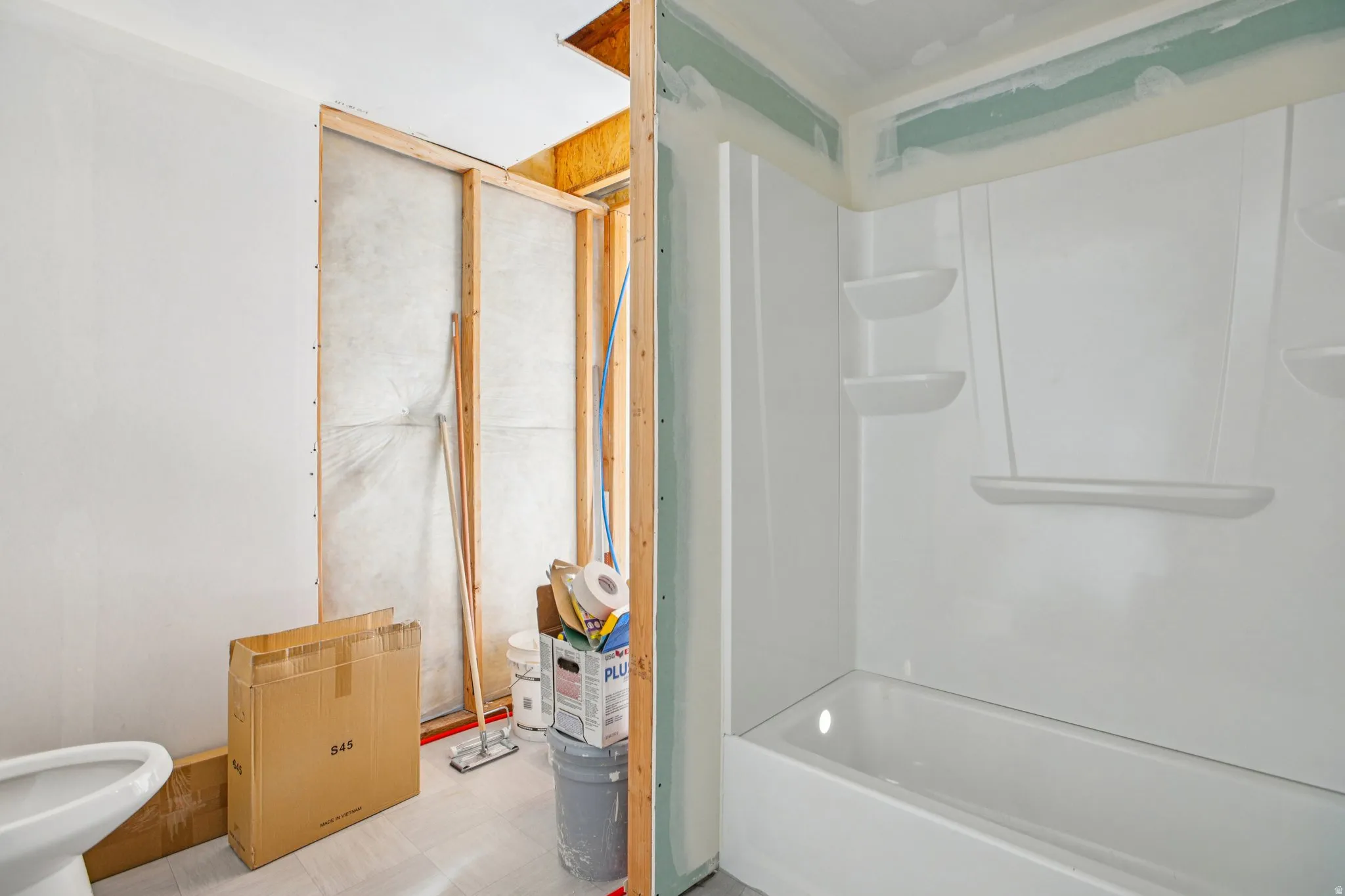 Full bathroom with bathtub / shower combination and light floors