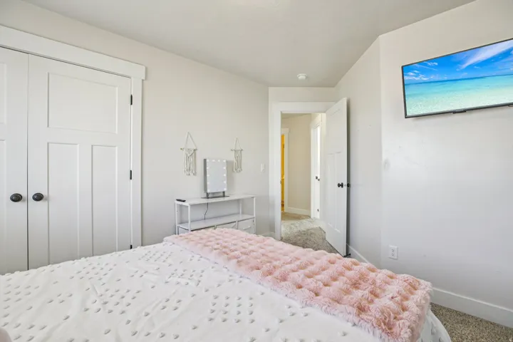 Bedroom featuring carpet floors and a closet