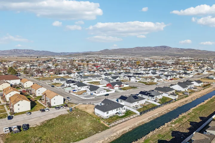 Aerial perspective of suburban area with a mountainous background