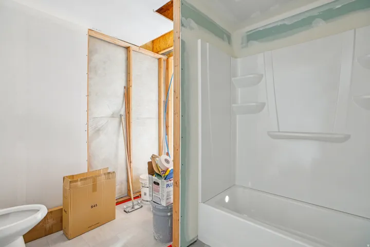 Full bathroom with bathtub / shower combination and light floors