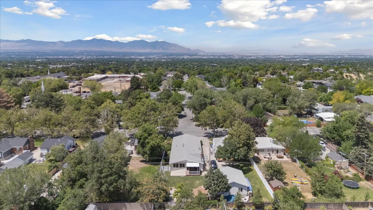 Aerial view of residential area featuring a mountain backdrop