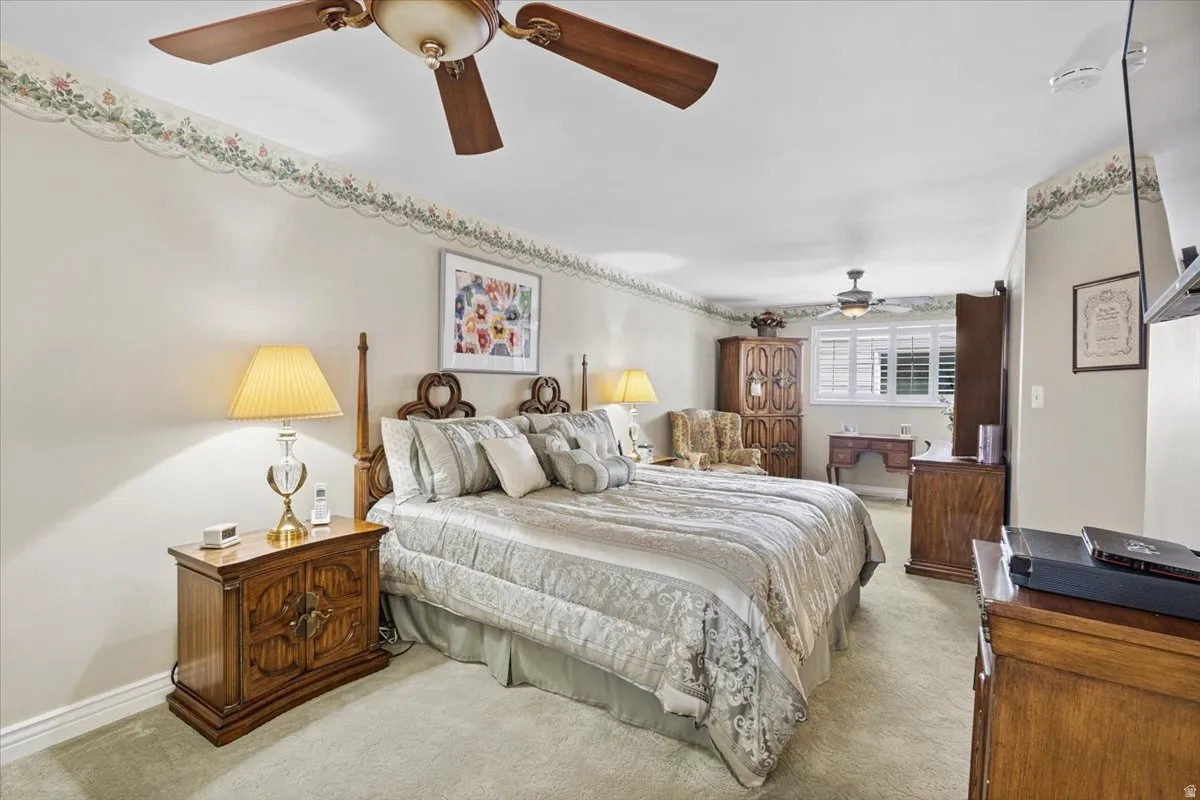 Bedroom with carpet flooring and a ceiling fan