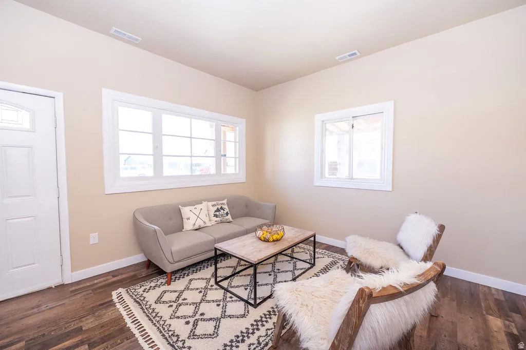 Living area with dark wood-style flooring