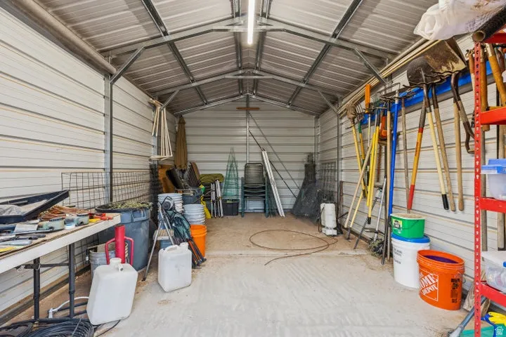 Garage featuring metal wall