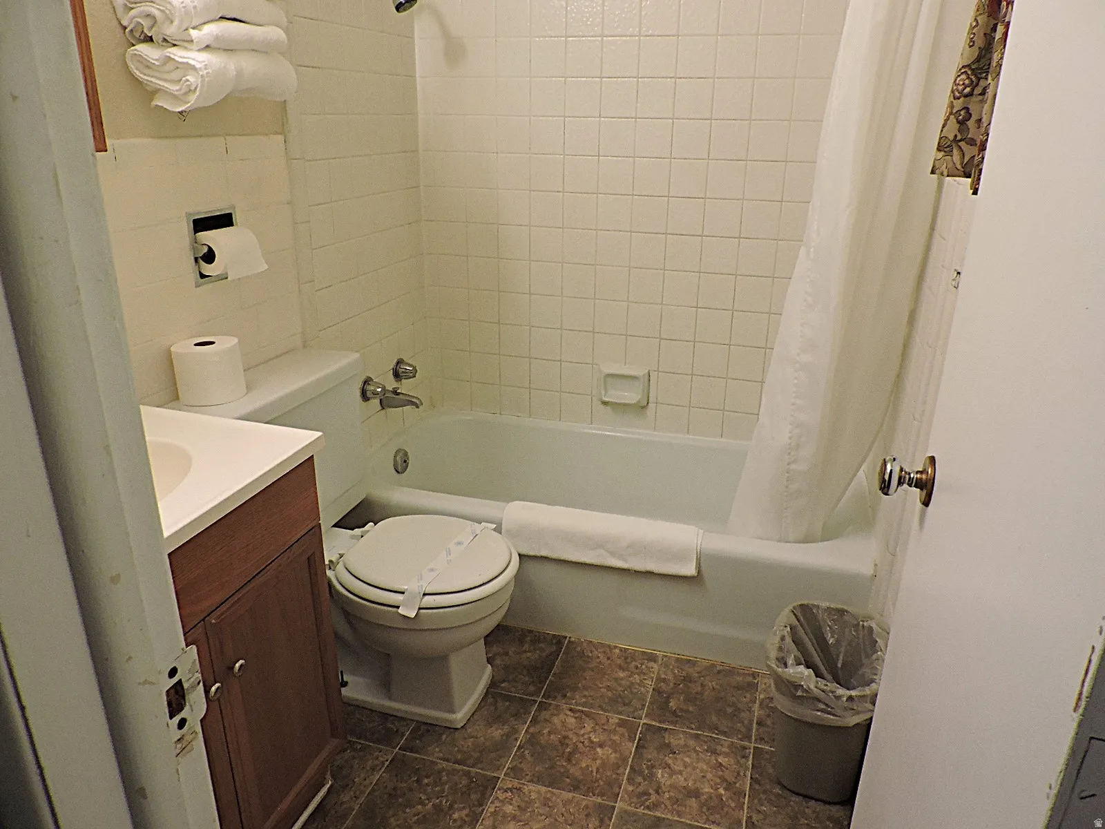 Full bathroom with vanity and shower / tub combo with curtain