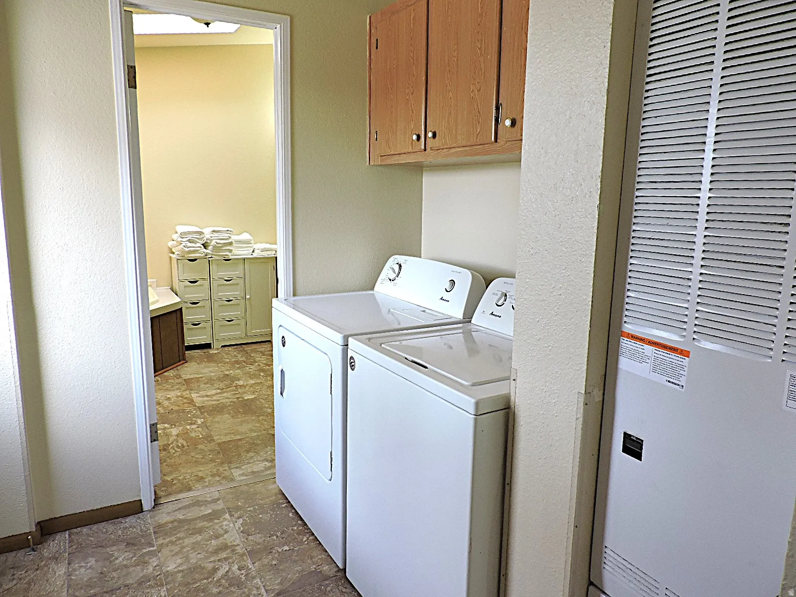 Laundry room in owner/manager home