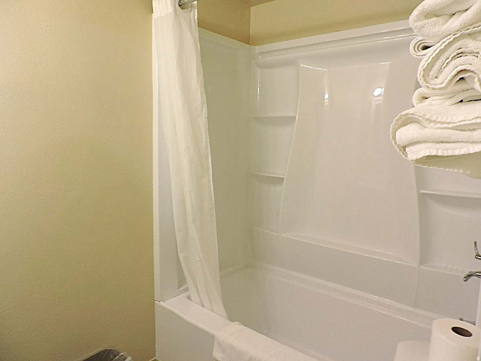 Bathroom featuring shower / tub combo and toilet