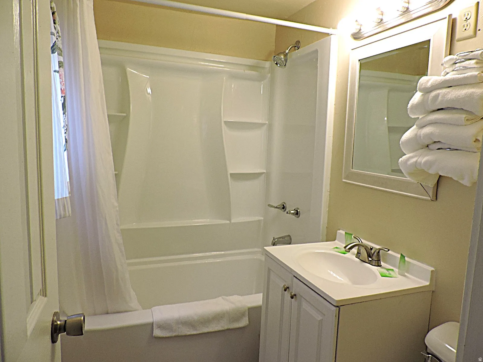 Bathroom featuring vanity and shower / tub combo