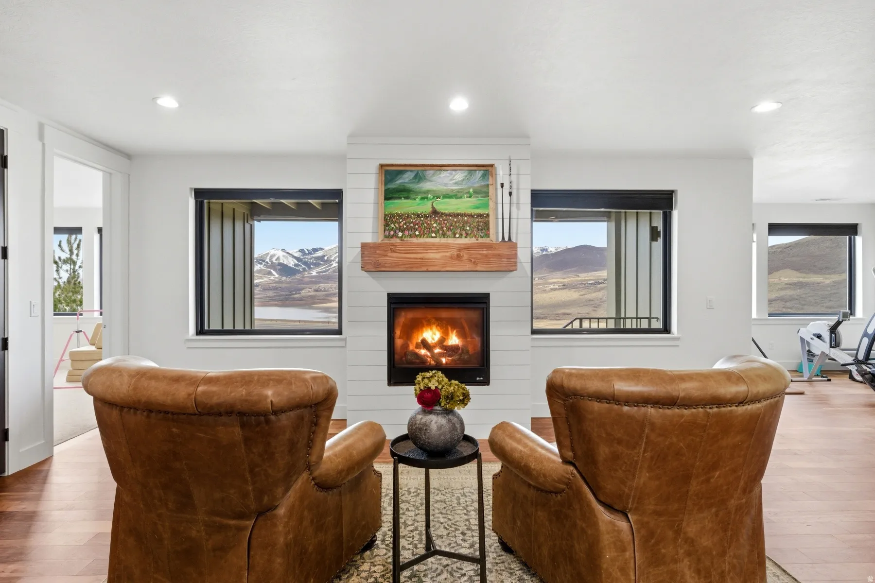 Living area featuring hardwood / wood-style floors, a fireplace, and recessed lighting