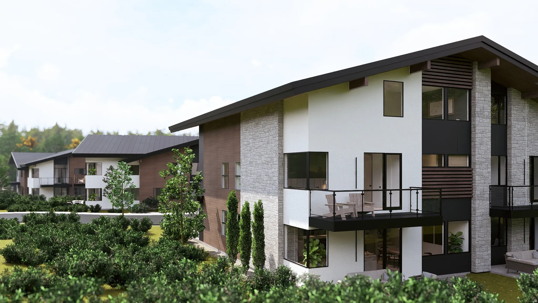 Back of house featuring a balcony and stucco siding